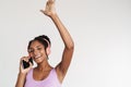 Portrait of african american woman using headphones and cellphone Royalty Free Stock Photo