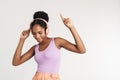 Portrait of african american woman using headphones and dancing Royalty Free Stock Photo