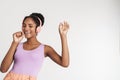 Portrait of african american woman using headphones while singing Royalty Free Stock Photo