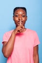 Portrait of african american young woman whispering confidential secret