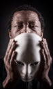 Portrait of african black man with white mask.