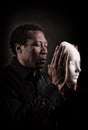 Portrait of african black man with white mask. Royalty Free Stock Photo