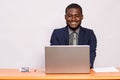 Portrait of an african businessman smiling while working Royalty Free Stock Photo