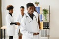 Portrait of a african doctor in front of his medical team. Royalty Free Stock Photo