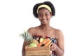 Portrait of African girl teen with curly hair wearing traditional clothes, holding tropical basket fruits. Happy smiling African Royalty Free Stock Photo