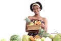 Portrait of African girl teen with curly hair wearing traditional clothes, holding tropical basket fruits. Happy smiling African Royalty Free Stock Photo