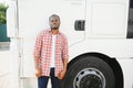 portrait African male happy Smiling confident positive near lorry. Young Man plaid shirt owner Truck Driver In Business Royalty Free Stock Photo