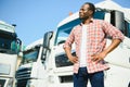 portrait African male happy Smiling confident positive near lorry. Young Man plaid shirt owner Truck Driver In Business Royalty Free Stock Photo