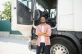 portrait African male happy Smiling confident positive near lorry. Young Man plaid shirt owner Truck Driver In Business Royalty Free Stock Photo