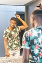 Portrait of an african man getting ready in the bathroom