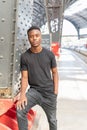 Portrait of african man posing. Indoor student and athletic man.