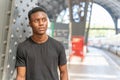 Portrait of african man posing. Indoor student and athletic man.