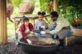 Portrait of African man and wife teaching the children to plant seedlings in greenhouse Royalty Free Stock Photo