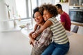 Portrait of african mother hugging with her daughter, enjoying moment of love, having fun together Royalty Free Stock Photo