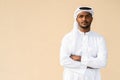 Portrait of African Muslim man wearing religious clothing an scarf with arms crossed Royalty Free Stock Photo