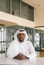 Portrait of African Muslim man wearing religious clothing an scarf at office Royalty Free Stock Photo