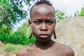 Portrait of African Teenager with a big traditional wooden earrings in the local Mursi tribe village Royalty Free Stock Photo