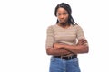 Portrait of a serious african woman with arms folded standing over gray background and looking away Royalty Free Stock Photo