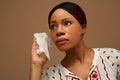 Portrait African woman remove her make up using wet towels. Royalty Free Stock Photo