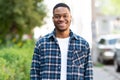 Portrait of afro guy listening to music looking at camera Royalty Free Stock Photo