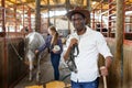 Portrait afro man horse farm worker Royalty Free Stock Photo