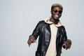 Portrait afroamerican man with playing invisible piano, looking at camera, isolated on grey background