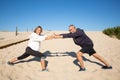 Portrait of aged couple demonstrating flexibility for camera