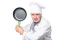 Portrait of aggressive evil chefs with frying pan