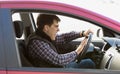 Portrait of aggressive male driver honking in traffic jam Royalty Free Stock Photo