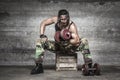 Portrait of aggressive muscle man lifting weights Royalty Free Stock Photo