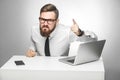 Portrait of aggressive unhappy young businessman in white shirt and black tie are blaming you in office and having bad mood, Royalty Free Stock Photo