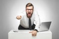 Portrait of aggressive unhappy young businessman in white shirt and black tie are blaming you in office and having bad mood, Royalty Free Stock Photo