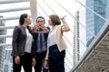 Portrait of Aggressive young Asian women in formal wear or businesswoman fighting while man dissuade for fight Royalty Free Stock Photo