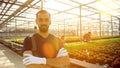 Portrait of agricultural farmer man working in greenhouse