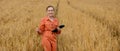 Portrait Agronomist farmer with digital tablet computer in wheat field