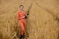 Portrait Agronomist farmer with digital tablet computer in wheat field.