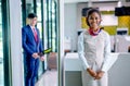 Portrait of air hostess and airline staff at gate of airport to welcome and check the security of passenger before go inside of