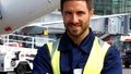 Portrait of aircraft marshaller smiling