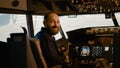 Portrait of airplane captain preparing to fly aircraft in cockpit Royalty Free Stock Photo