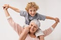 Portrait, airplane and grandmother with child embrace, happy and bonding against wall background. Love, face and senior