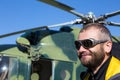 Portrait of Alpine Climber Preparing for Boarding to Helicopter