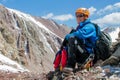 Portrait of alpinist in helmet in the high mountains