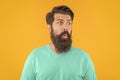 portrait of amazed bearded man in studio. portrait of bearded man on background.