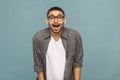 Portrait of amazed handsome man with black glasses in casual sty