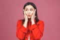 Portrait of amazed shocked young woman isolated over pink background Royalty Free Stock Photo