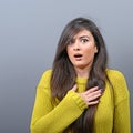 Portrait of a amazed woman against gray background Royalty Free Stock Photo