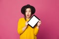 Portrait of amazed young woman showing tablet screen Royalty Free Stock Photo