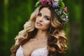 Portrait of amazing beauty, blonde model girl with floral wreath on her head Royalty Free Stock Photo