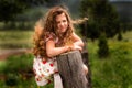 Portrait of Amazing Girl with luxurious hair on a fence