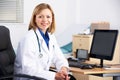 Portrait American doctor sitting at desk